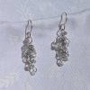 Sky's the Limit Earrings: Pale blue and clear beaded earrings with three hues and various textures, sterling silver hooks for a stylish and unique look.