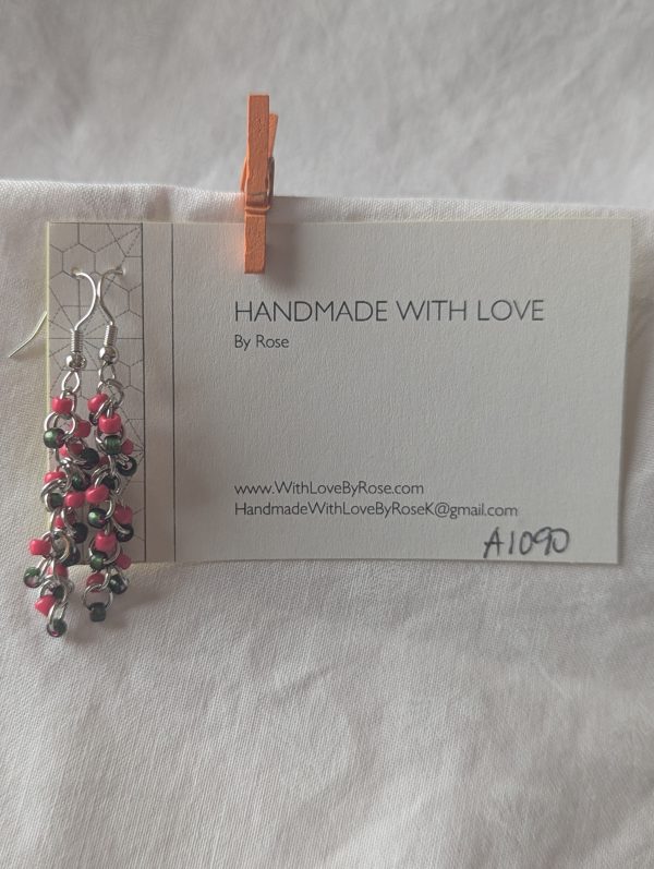 Watermelon Bliss earrings with pearly green and hot pink beads, steel-colored jump rings, and earring hooks.