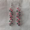 Watermelon Bliss earrings with pearly green and hot pink beads, steel-colored jump rings, and earring hooks.