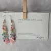 Radiance Lined Earrings: 27 clear glass beads, each lined in rainbow colors: red, yellow, seafoam, green, blue, purple, hot pink, and pale pink, connected with rose-gold-colored jump rings.