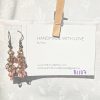 Caption: Blushed Bronze – Handmade dangle earrings featuring 18 beads in soft pink and mauve shades with bronze-colored jump rings and matching earring hooks.