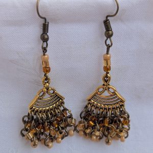 Desert Dusk Earrings: Antiqued gold chandelier-style earrings with 30 beads in silver-lined brown, silver-lined tan, and pearly beige, finished with bronze-colored hooks.