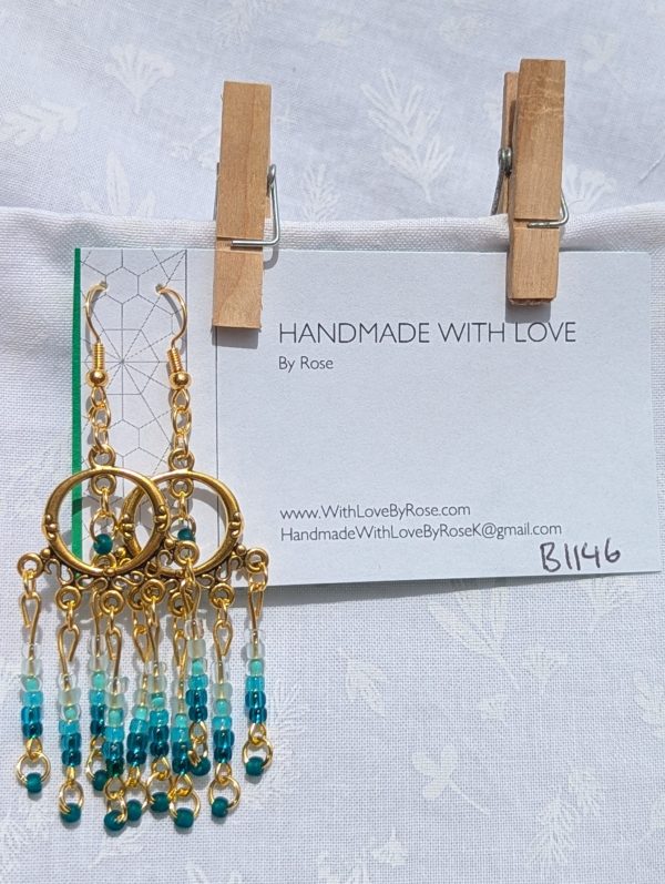 Ocean Depths Earrings: Gold circular earrings with 36 teal gradient glass beads in various textures, from seafoam to deep ocean tones.
