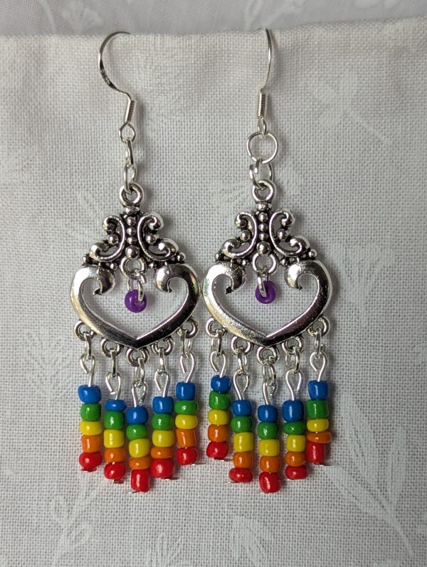 Rainbow heart earrings with silver filigree hearts and colorful glass seed bead strands in red, orange, yellow, green, blue, and purple.