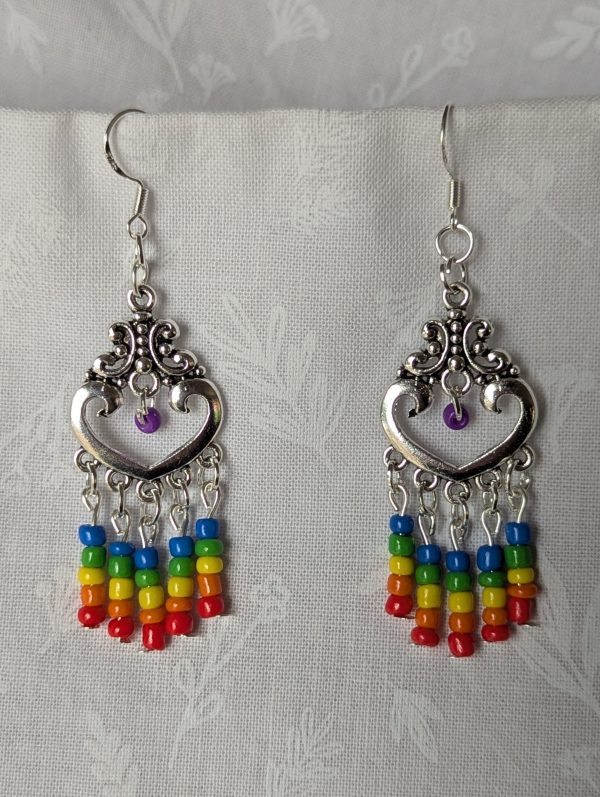 Rainbow heart earrings with silver filigree hearts and colorful glass seed bead strands in red, orange, yellow, green, blue, and purple.