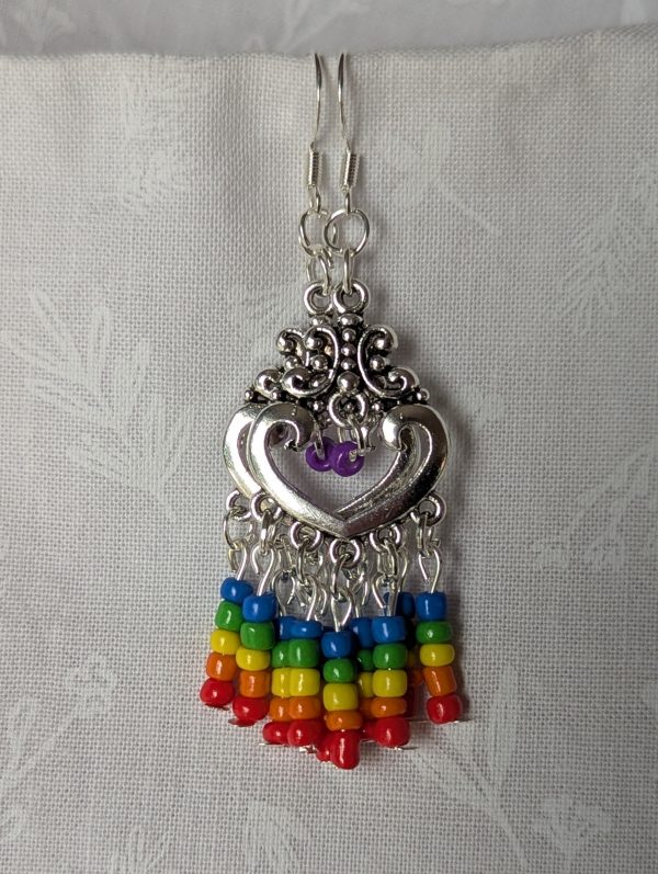 Rainbow heart earrings with silver filigree hearts and colorful glass seed bead strands in red, orange, yellow, green, blue, and purple.