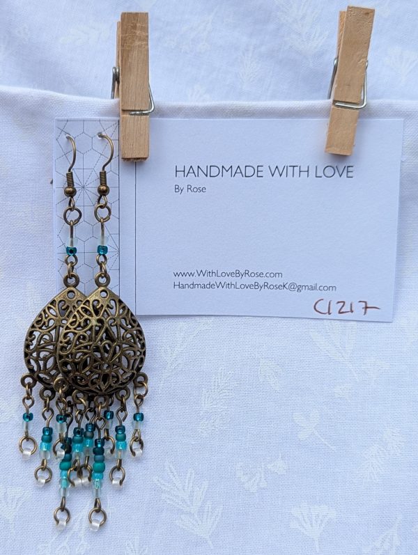 Ocean Lace Earrings; Bronze teardrop earrings with teal gradient beads from dark green to white.