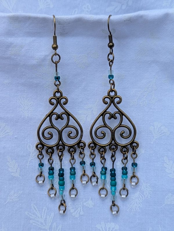 Tidal Filigree Earrings: bronze earrings with teal gradient beaded strands from dark to light.