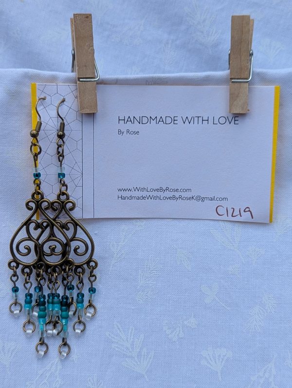 Tidal Filigree Earrings: bronze earrings with teal gradient beaded strands from dark to light.
