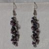 Shadow Galaxy Earrings with 27 beads in matte gray, frosted plum, and iridescent galaxy tones, linked with tungsten-colored rings and steel hooks.