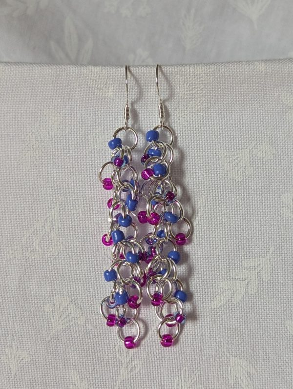 Electric Bloom Earrings with 27 beads in silver-lined hot pink, solid periwinkle, and pink-lined blue, linked with thick silver rings and sterling silver hooks.