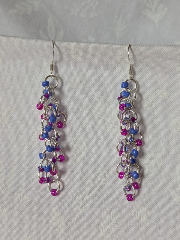 Electric Bloom Earrings with 27 beads in silver-lined hot pink, solid periwinkle, and pink-lined blue, linked with thick silver rings and sterling silver hooks.