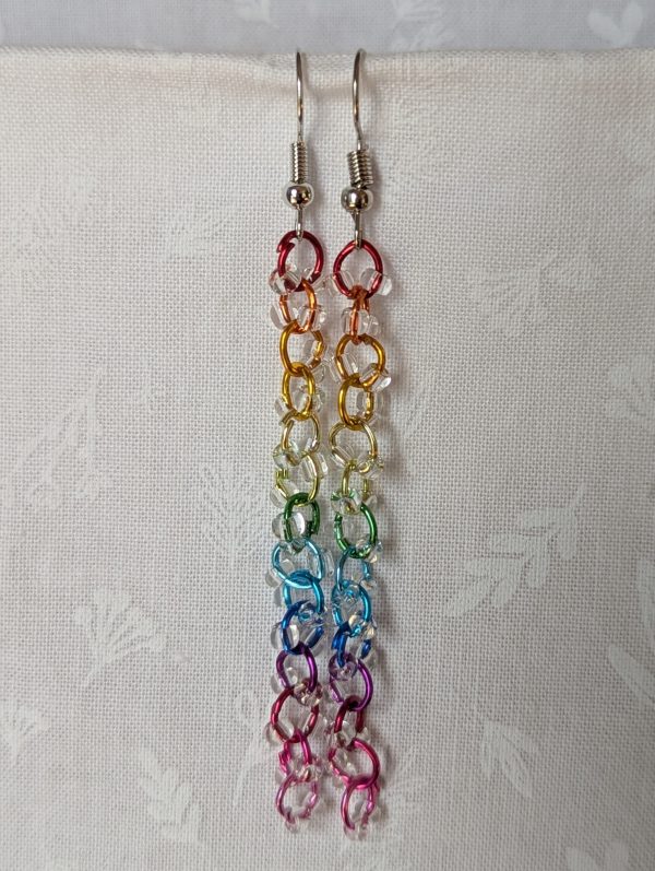 Prismatic Dewdrop Earrings with 28 clear glass beads wrapped around 14 rainbow-colored jump rings, hanging from steel-colored earring hooks.