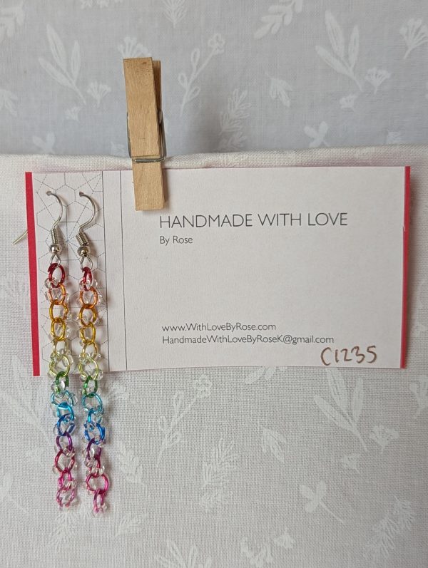 Prismatic Dewdrop Earrings with 28 clear glass beads wrapped around 14 rainbow-colored jump rings, hanging from steel-colored earring hooks.