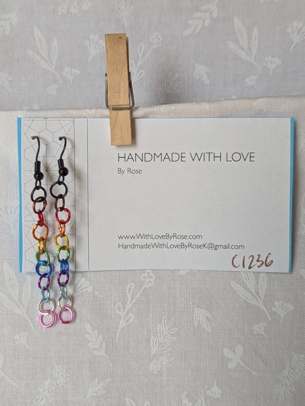 Rainbow Pride Earrings made with 13 rainbow-colored jump rings per earring, finished with sleek black hooks. Reminiscent of the Pride, Trans, and BLM flag.