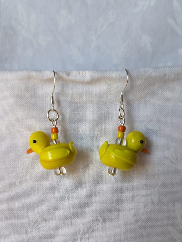 Handmade yellow duck earrings with yellow glass duck beads, orange and yellow seed beads, on sterling silver hooks.