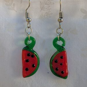 Handmade glass watermelon slice earrings with pink-red centers, green rinds, and sterling silver hooks.