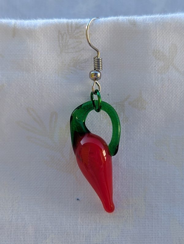Handmade red pepper earrings featuring a single glossy red glass chili pepper bead with a green aluminum jump ring on steel hooks.
