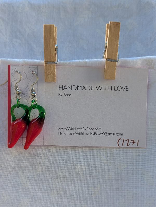 Handmade red pepper earrings featuring a single glossy red glass chili pepper bead with a green aluminum jump ring on steel hooks.