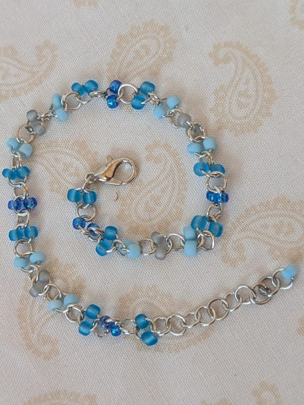 Tidal Mist Blue gradient bracelet with silver chain and paired glass seed beads in blue-gray and sky blue tones