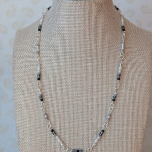 Silver chain necklace with black, gray, and white gradient glass seed beads and lobster clasp